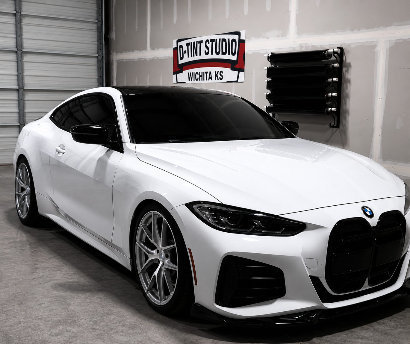 White BMW 4 Series with tinted glass