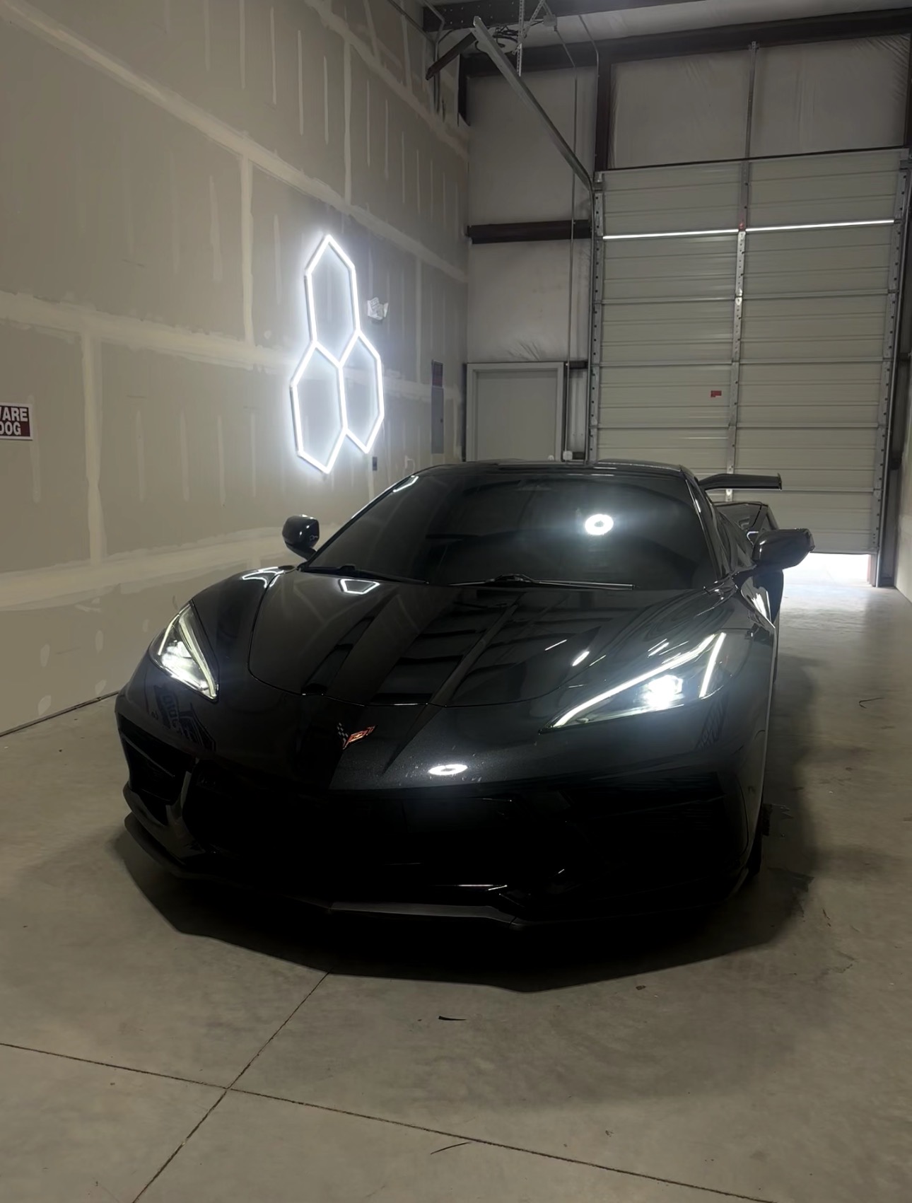 Black Corvette C8 with tinted windows in the studio